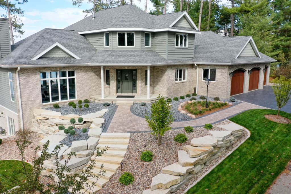Formal stone steps leading to an upper terrace, part of the property’s landscape design — Oshkosh, WI