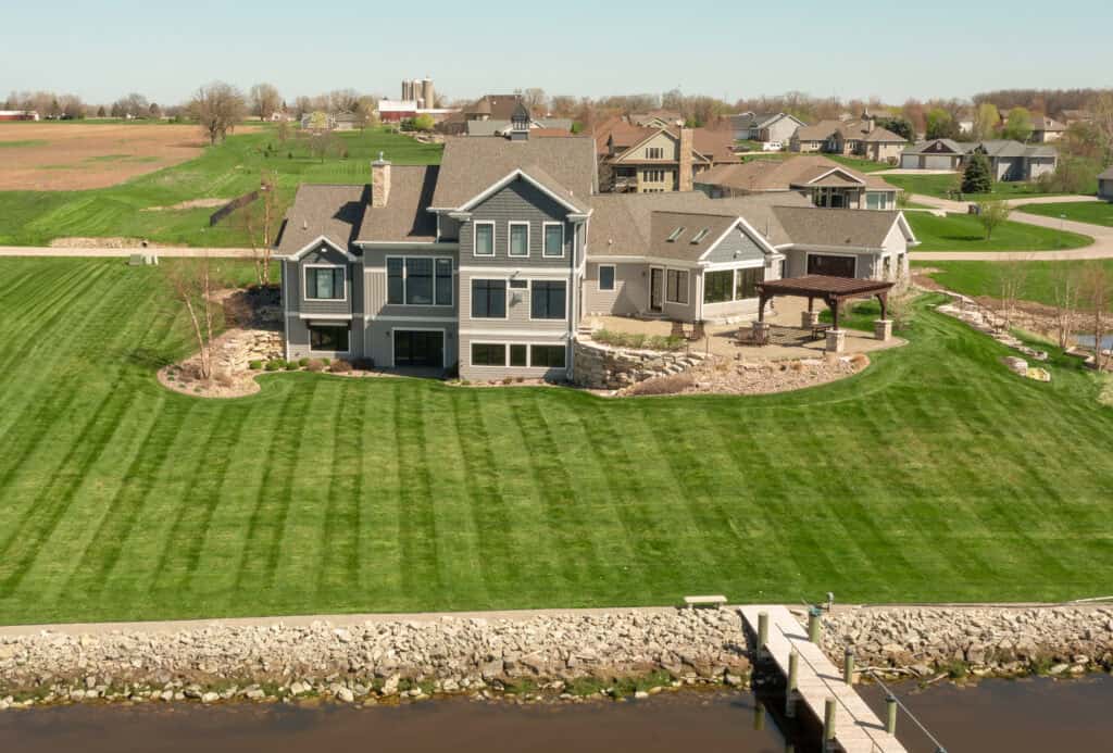 landscape design with bluestone terrace and curved beds in West Bend, WI