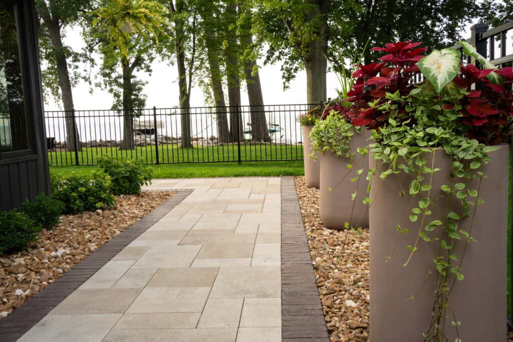 Backyard paver patio with seating wall and outdoor lighting in Oshkosh, WI