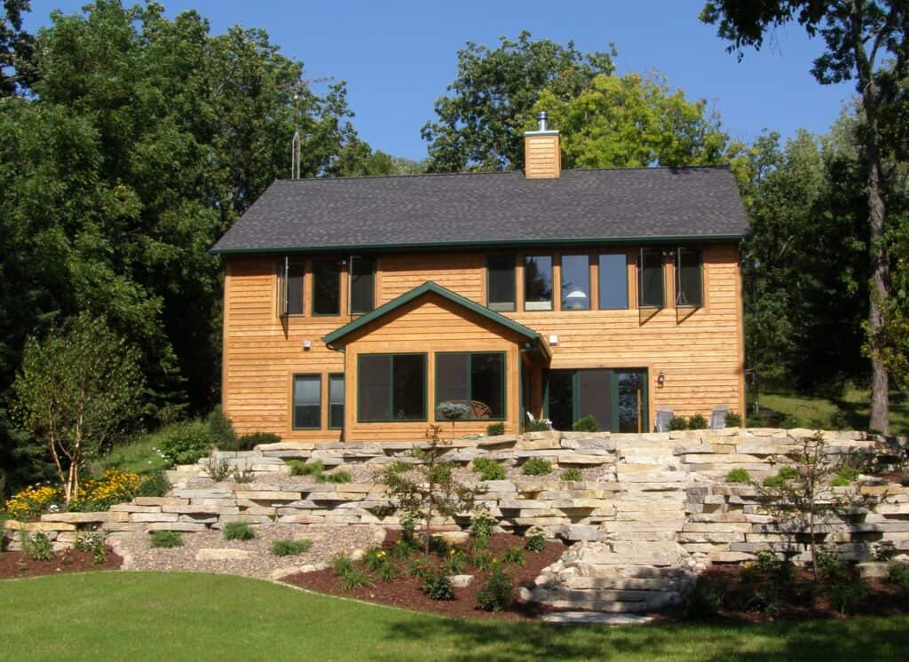 retaining wall with weathered stone face and stepped terraces in West Bend, WI