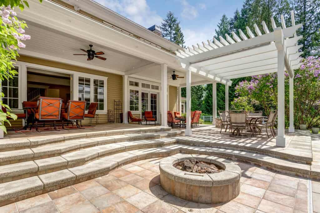 pergola with slatted roof over a paver dining patio in West Bend, WI
