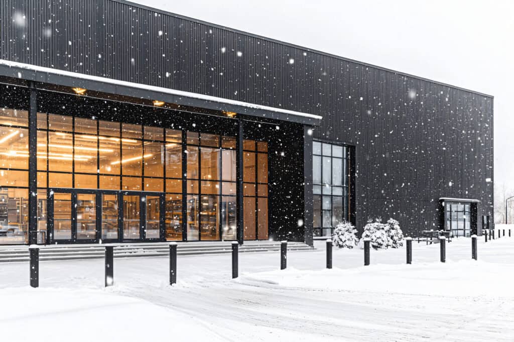 Sidewalk de-icing and snow clearing crew at office complex in Winnebago County, WI